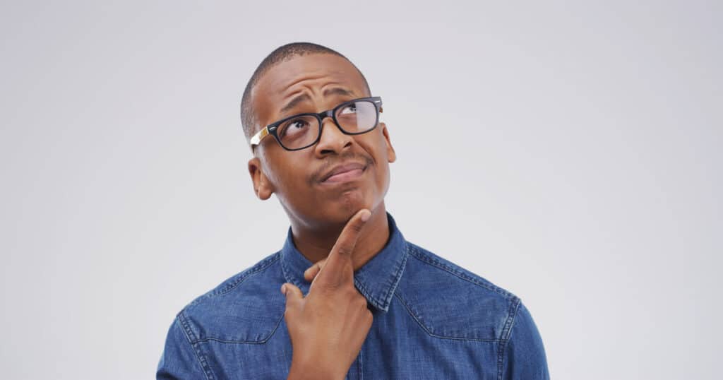 A man is wondering, "Why does my furnace smell?"